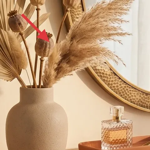 dried-stem arrangement in vase