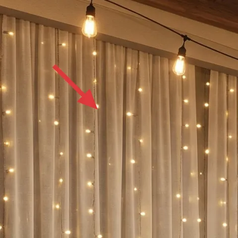 string lights along the ceiling beams