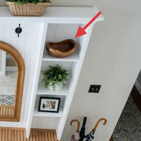 brown wooden bowl on the right shelf