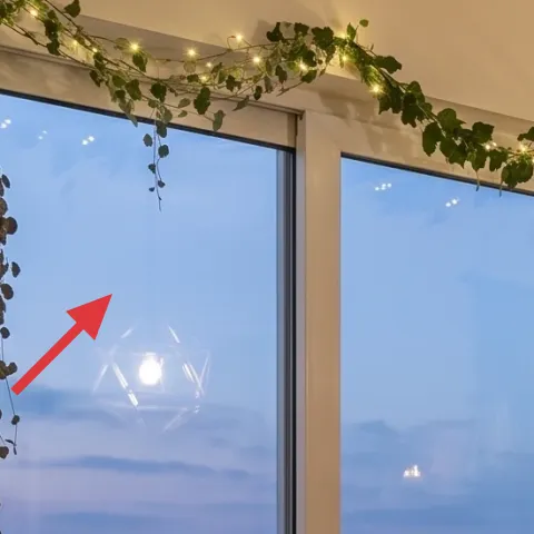 macramé plant holder by window