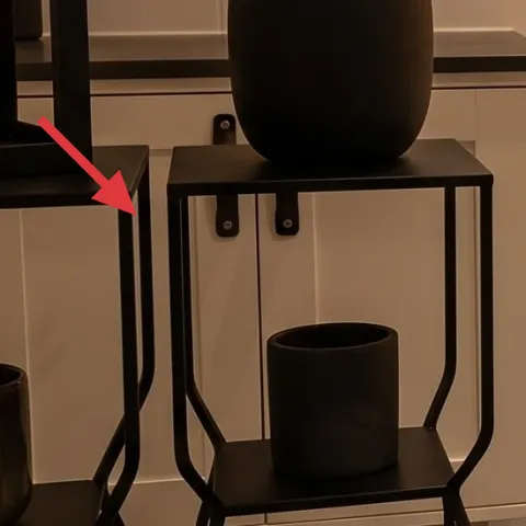 black metal console table with lower shelf