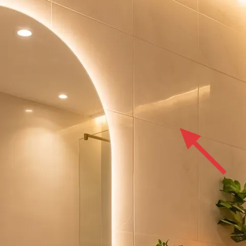 Backlit arched mirror