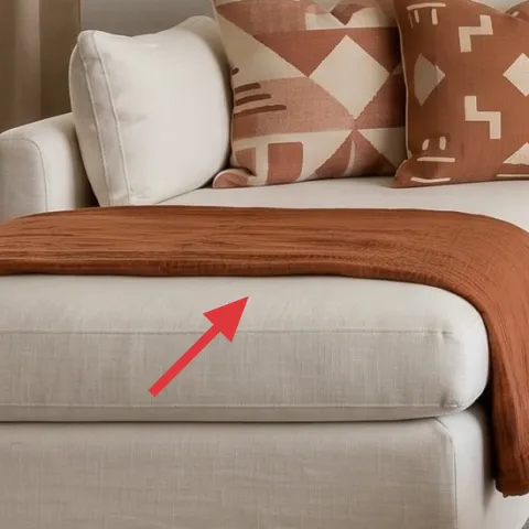brown throw blanket on chaise