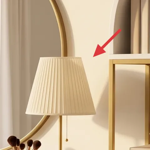 round gold-framed mirror