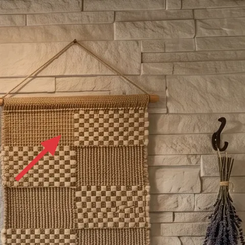 woven wall hanging on rope rod