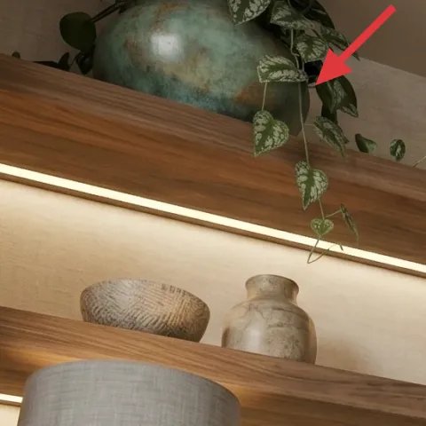 teal ceramic vase on upper shelf